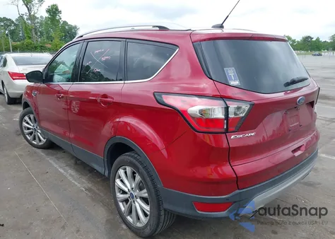 2017 Ford Escape Titanium z USA, uszkodzony, nr VIN 1FMCU0J97HUE84151
